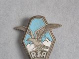 an image of a badge with a bird on it on a table