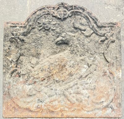 an image of a stone plaque with a bird on it
