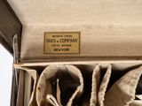 two pairs of shoes in a box with a label on it