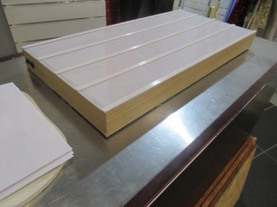 a stack of books sitting on top of a metal counter