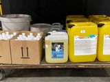 a cart with several containers of liquid and a bucket of water