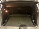 a trunk of a car with the back door open