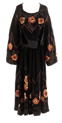 an image of a black dress with orange flowers on it