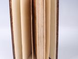 an open book that is sitting on a table