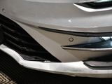a close up of a car with a license plate on the front of it