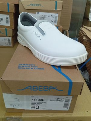 a white shoe that is on top of a box