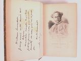 an open book with a drawing of a man in a hat on it