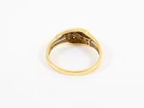 a close up of a gold ring on a white surface