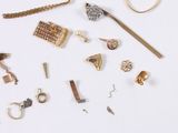many different types of jewelry on a white surface