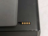 a close up of a laptop that has a small chip on it