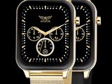 deux montres en or avec un cadran noir sur fond noir