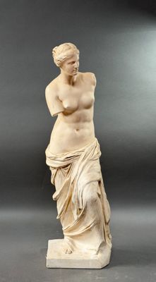 statue of a woman holding a vase in her right hand