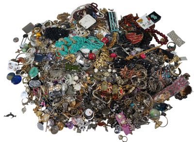 a pile of assorted jewelry sitting on top of a table