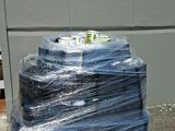 a stack of blue plastic bags sitting on the ground
