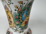 a vase that has a colorful design on it