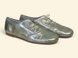 silver leather shoes with laces on a white background