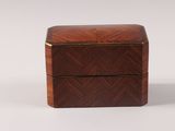 a small wooden box with two drawers on top of it