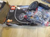 a box of lego technics sitting on the floor