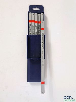 three pens and a pen holder on a white surface