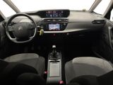 the interior of a small car with a steering wheel and dashboard