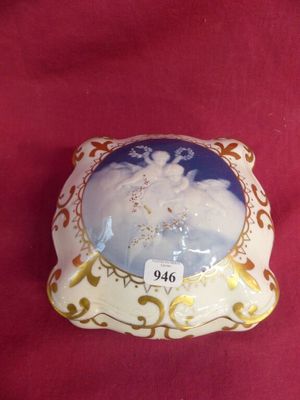 a small porcelain box with a picture of a snowman on it