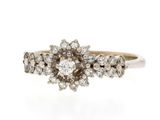 a close up of a diamond ring on a white background