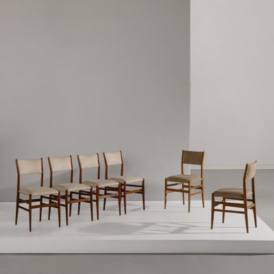 a group of chairs sitting on top of a white platform