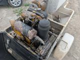 a truck with an old engine in the back of it