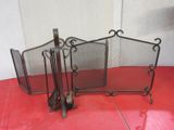 three metal fireplace screens sitting on a red floor
