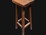 an old wooden stool on a black background with a black background