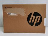 the box is open on a white surface with a black hp logo on it