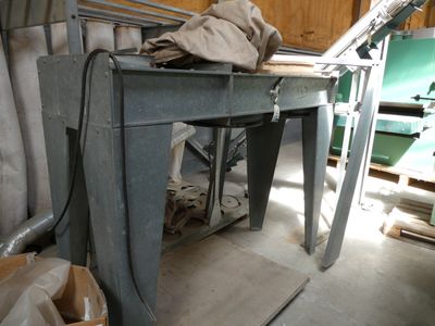 a table with a cloth on top of it in a room
