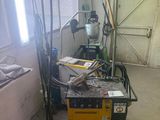 a picture of a room with a table and a work bench