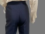 an image of a man in a white shirt and blue pants