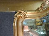 a woman taking a picture of herself in a mirror