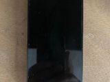 a close up of a cell phone sitting on a table