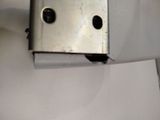 a piece of metal that has a face on it