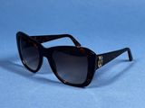 a close up of a pair of sunglasses on a blue surface