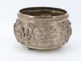 a large metal bowl with a design on it