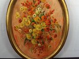 a picture of a painting of flowers in a gold frame