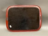 an image of a red tray with a mirror on top of it
