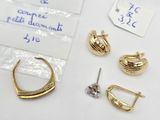a lot of jewelry on a table with a price tag