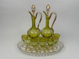 a lot of green glass items on a glass tray