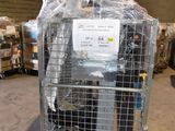 a metal cage with a sign on it in a warehouse