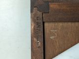 a close up of a piece of wood with writing on it