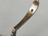 a spoon that has a spoon in it on a table