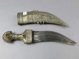 two knives that are sitting on a table