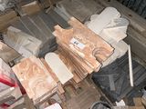 a pile of boxes and boxes of wood and other items