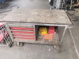 an old workbench with a lot of tools on it