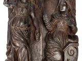 une photo représentant une statue d'une femme et d'un homme assis sur un banc